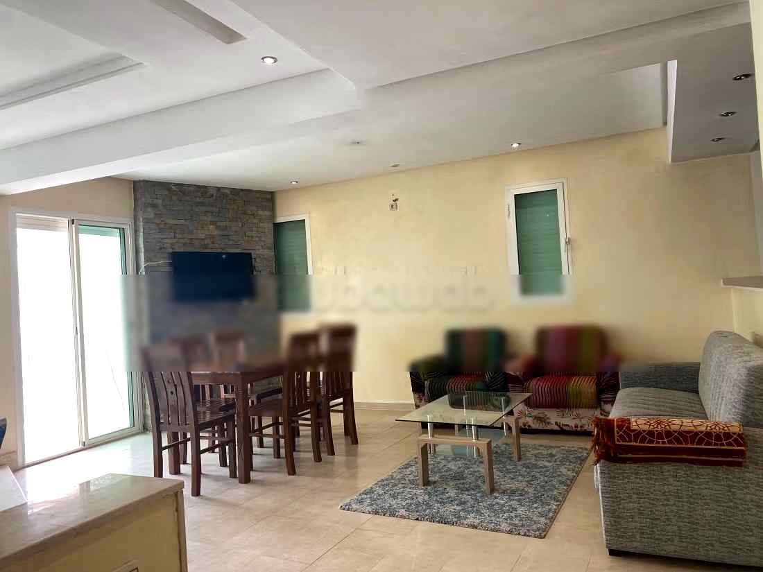 Location saisonnière à Agdal. 
Superficie 170 m². 
Salon traditionnel et système d'antenne parabolique - Photo 7